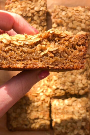 Fudgy oat blondies with cinnamon oat topping sliced into squares