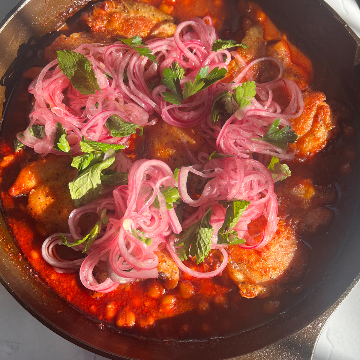 Skillet Harissa Chicken with Saucy Chickpeas