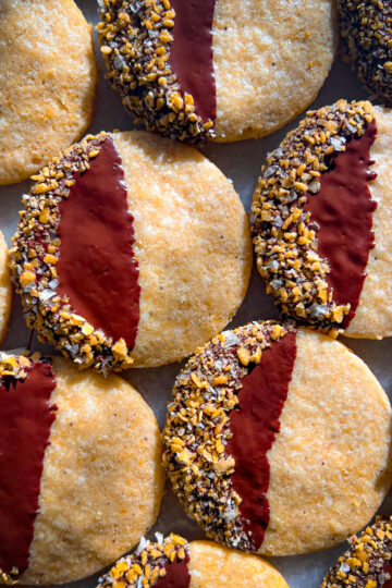 Browned butter cornflake crunch cookies dipped in dark chocolate and coated with flaky salt
