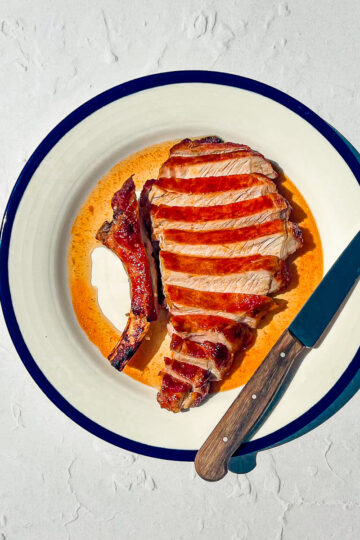 Smoky dry rub pork chops cooked in the air fryer with a caramelized crust