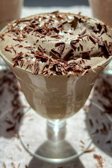 Easy mocha mousse topped with shaved chocolate in a glass