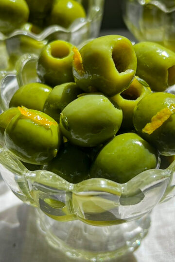 Citrus marinated Castelvetrano olives with orange zest, lemon zest, thyme, and olive oil