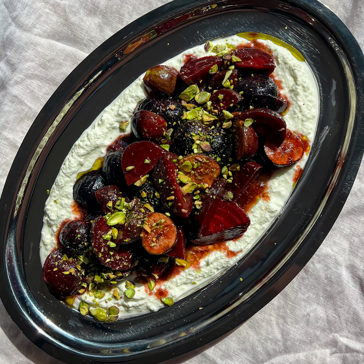 Honey balsamic beets and figs spooned over creamy ricotta and topped with pistachios
