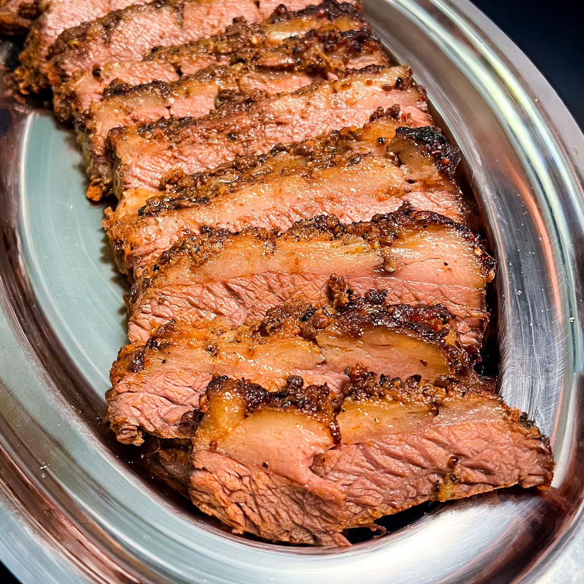 Pastrami Seasoned Brisket on a silver platter